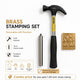 Brass stamping set with hammer, stamp handle, and brass stamp on a white background